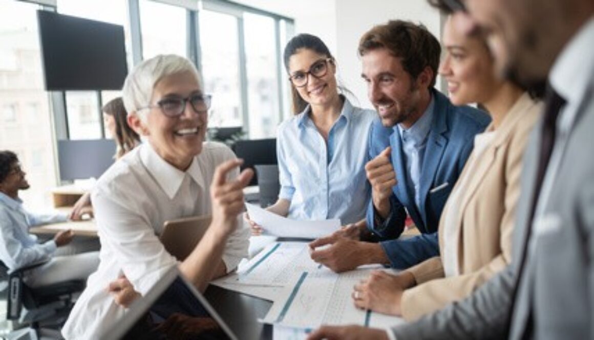 Group of young business people working and communicating at the office